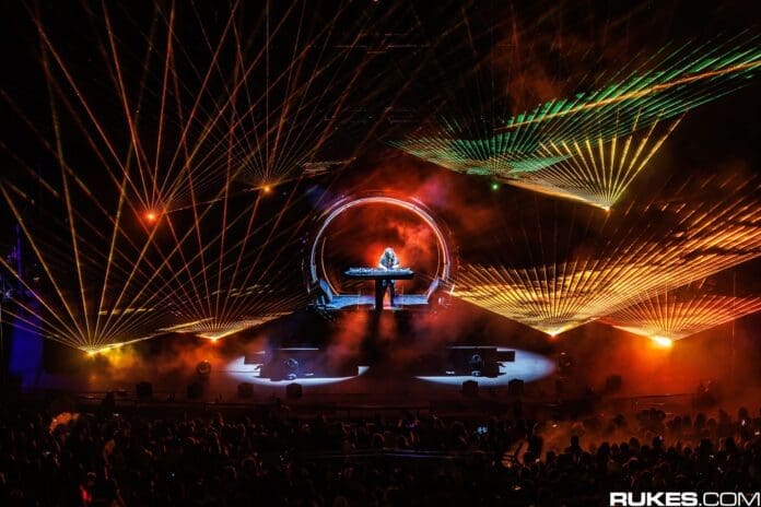 A man on stage with laser lights behind him during Subtronics' two-night takeover of Washington's Tacoma Dome.