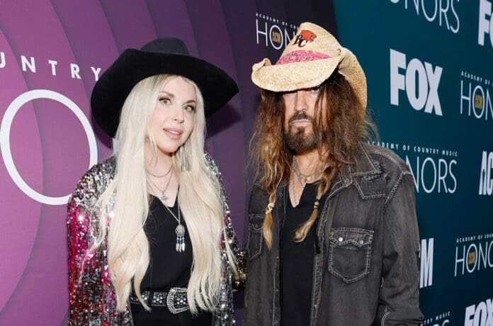 Fiancee Firerose and Billy Ray Cyrus make red carpet debut at ACM Honors.