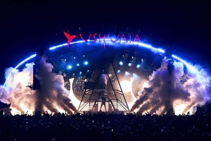 A [large stage] with [smoke] coming out of it.