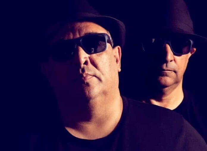 Two men in black hats and sunglasses unveil Bubba Brothers' new single, 'Wasabi', against a black background.