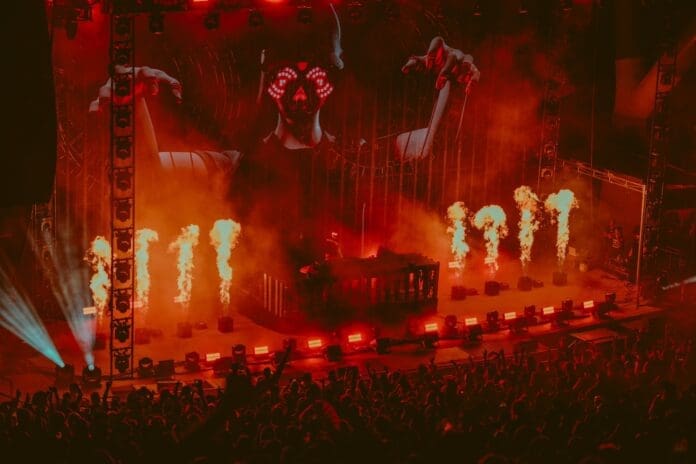 REZZ performs on a fiery stage at Red Rocks.