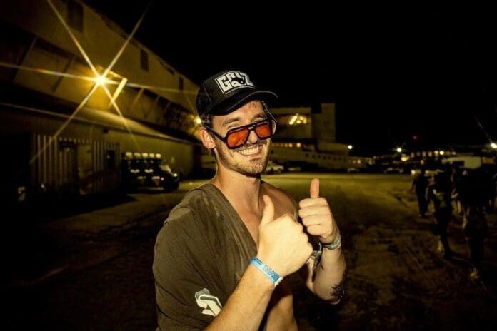 A man wearing sunglasses giving a thumbs up during GRiZ's final three Denver shows before an indefinite hiatus.