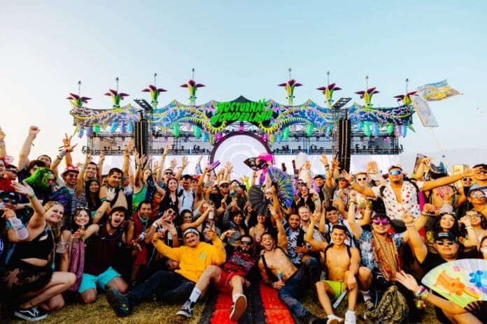 People posing at a festival.