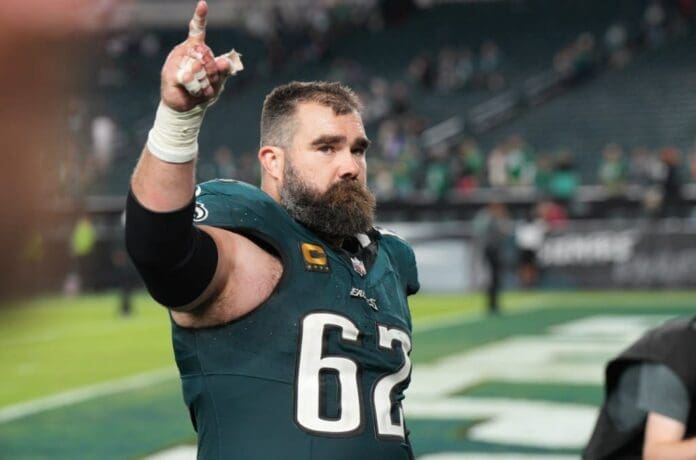 A Philadelphia Eagles player with a beard giving a thumbs up.