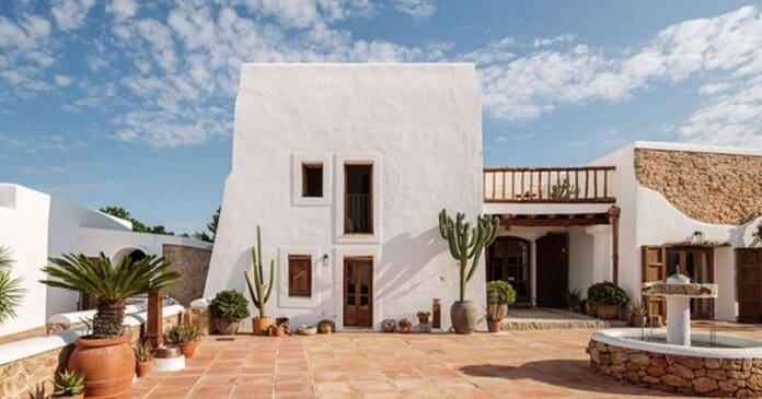 A white house with cactus in the courtyard, offering a chance to win a trip to Ibiza with San Miguel.