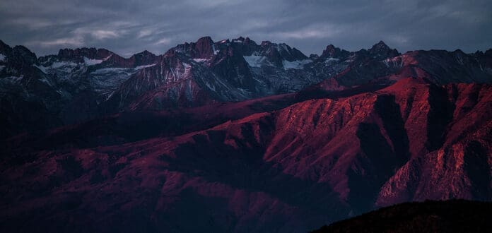 A mountain range at dusk with a red sky as Willy Hobal releases a new EP.