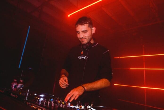 A man 'stuns' as he dj's in a dark room with red lights on his new EP ‘No Sunset for Soul’.