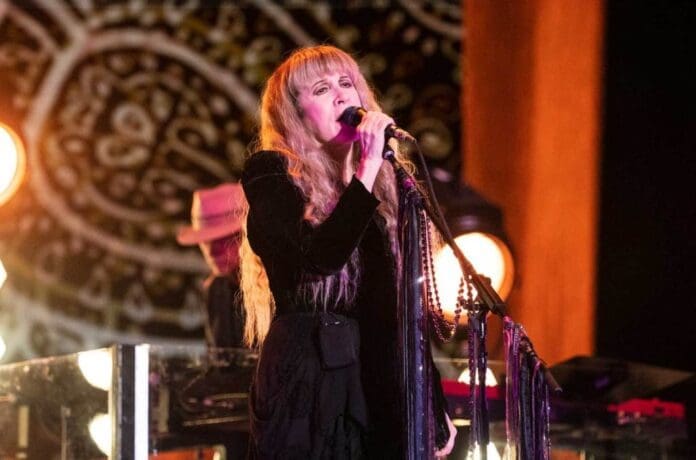 A woman singing into a microphone.