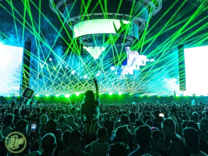 A crowd at a concert with green lasers, over a month later lawsuits are still rolling in.