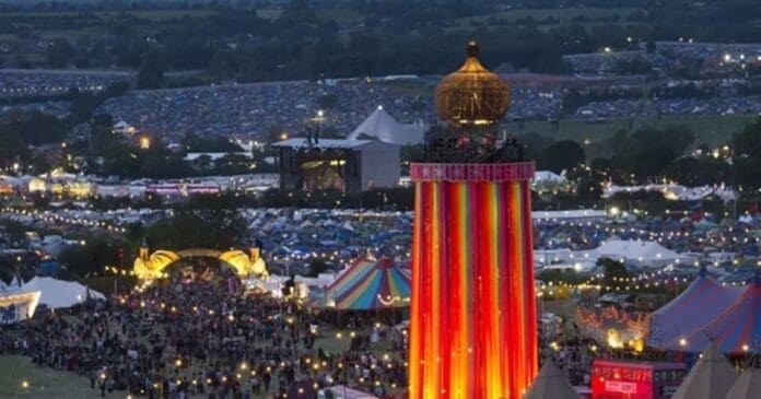 An aerial view of a large tent at a festival, where Emily Eavis teases headliners for Glastonbury Festival 2024.