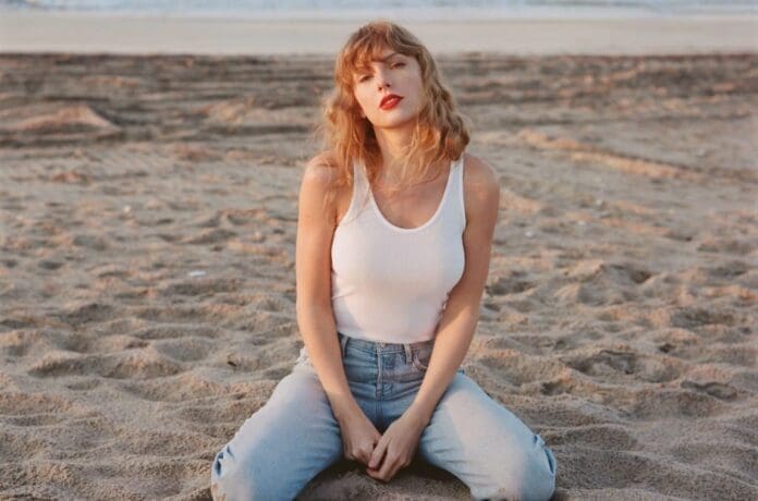 Taylor Swift enjoys the serene beach, while listening to her latest release 