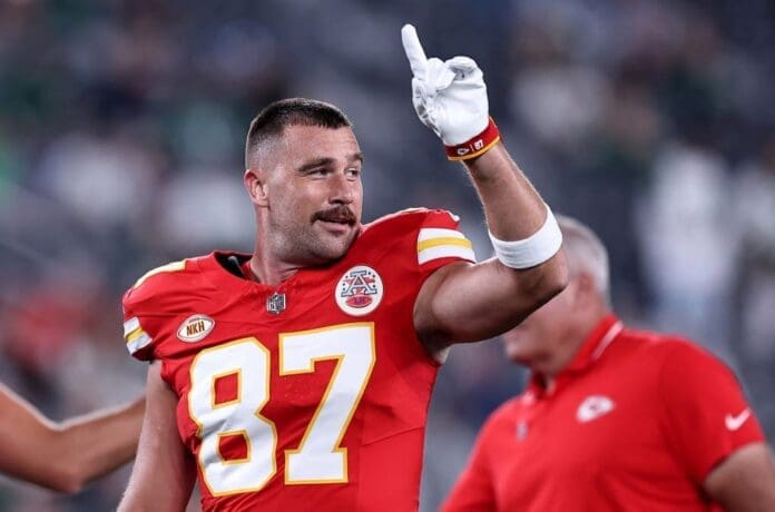 A Kansas Chiefs football player giving a thumbs up.