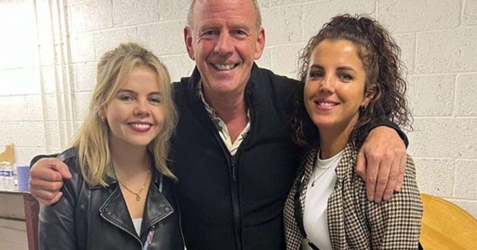 Fatboy Slim brings out Derry Girls cast members for a picture with an older man.