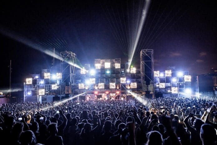 A crowd of people at the 3rd Indian Edition of the Global Festival Giant, DGTL, as it returns at night.