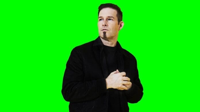 Darude standing in front of a green screen, bringing us together with his latest LP.