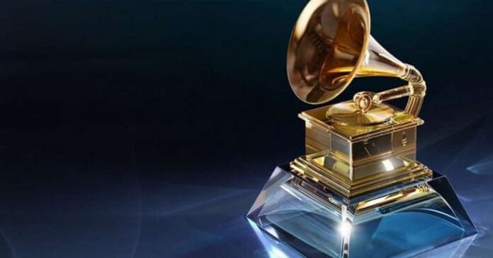 A golden Grammy trophy on top of a blue background, representing excellence in music.