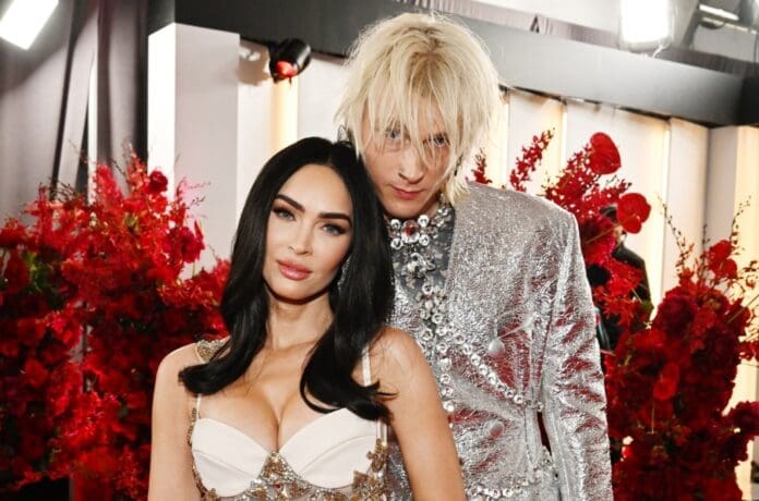 At the Grammys, Megan Fox and MGK strike a pose for a photo.