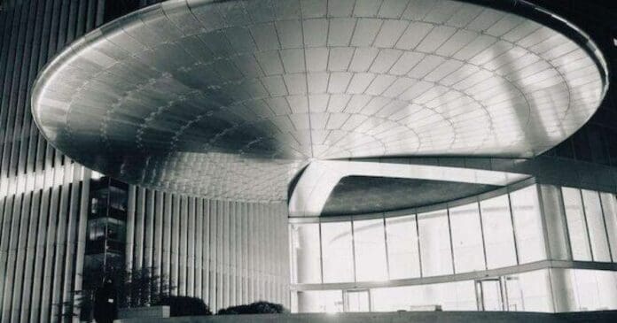 A black and white photo of a visually striking building with a circular roof, showcasing François X's artistic evolution.